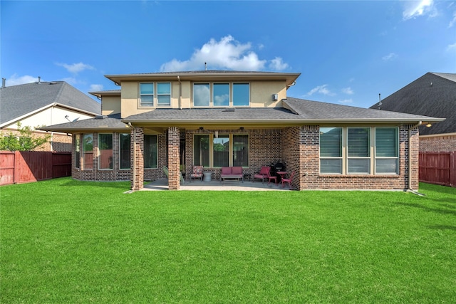 3310 Ralston Edge Ln, Houston, TX 77059 - back of property with a fenced backyard, a patio area, brick siding, and stucco siding