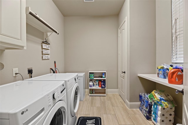 3310 Ralston Edge Ln, Houston, TX 77059 - laundry area featuring cabinet space, independent washer and dryer, and baseboards