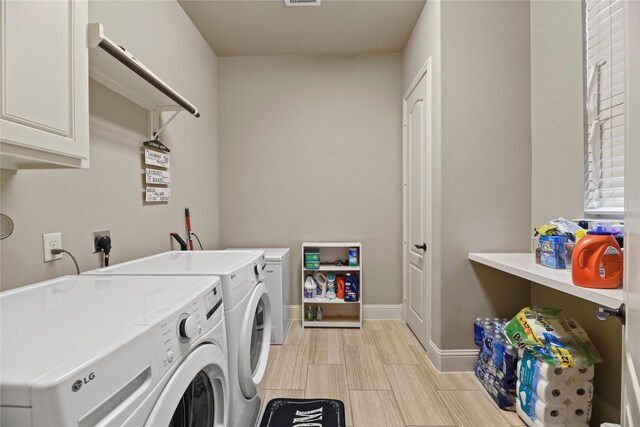 3310 Ralston Edge Ln, Houston, TX 77059 - laundry area featuring cabinet space and independent washer and dryer