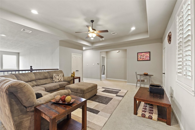 3310 Ralston Edge Ln, Houston, TX 77059 - living area featuring ceiling fan, light carpet, a raised ceiling, recessed lighting, and baseboards