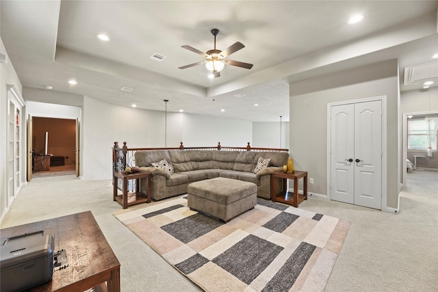 3310 Ralston Edge Ln, Houston, TX 77059 - living area featuring light carpet, ceiling fan, a raised ceiling, recessed lighting, and attic access