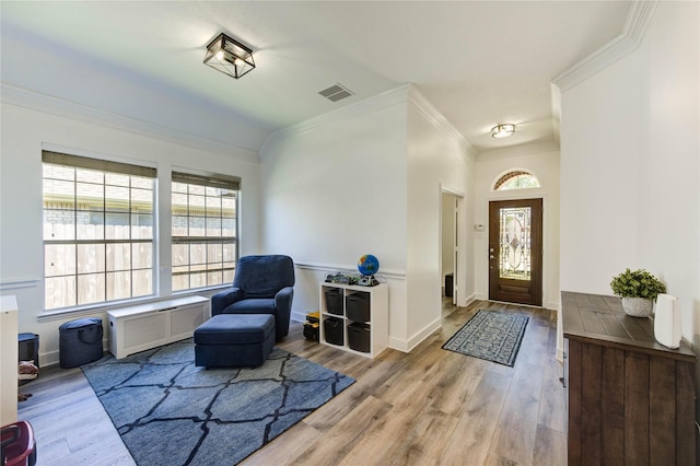 12006 Bright Landing Ct, Pearland, TX 77584 - entrance foyer with ornamental molding, wood finished floors, baseboards, and a wall mounted air conditioner