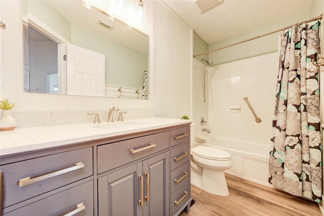12006 Bright Landing Ct, Pearland, TX 77584 - bathroom featuring vanity, toilet, wood finished floors, and shower / bathtub combination with curtain