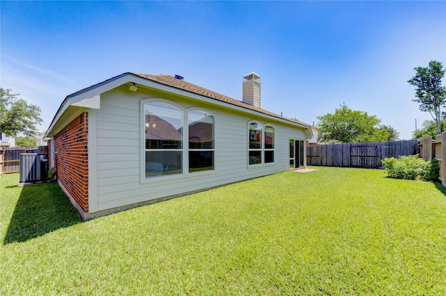 12006 Bright Landing Ct, Pearland, TX 77584 - rear view of property with a chimney and cooling unit