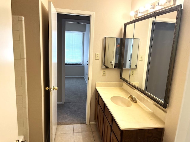 21007 Rivershadows Ln, Spring, TX 77388 - bathroom with vanity, baseboards, and tile patterned floors