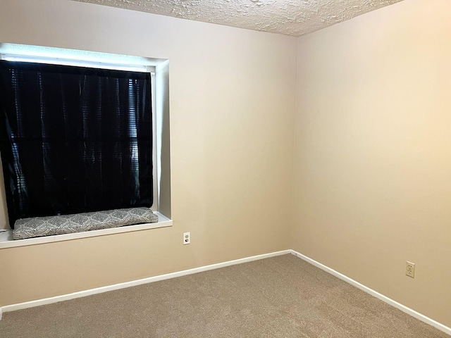 21007 Rivershadows Ln, Spring, TX 77388 - carpeted empty room featuring a textured ceiling and baseboards