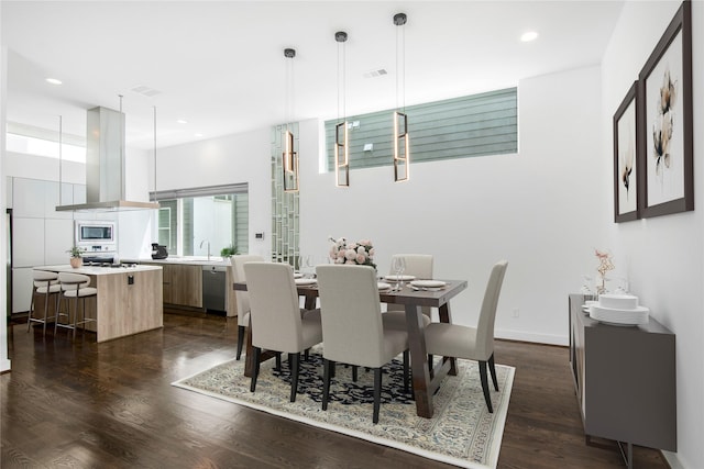 1155 W 18th St, Houston, TX 77008 - dining room featuring dark wood-type flooring and recessed lighting