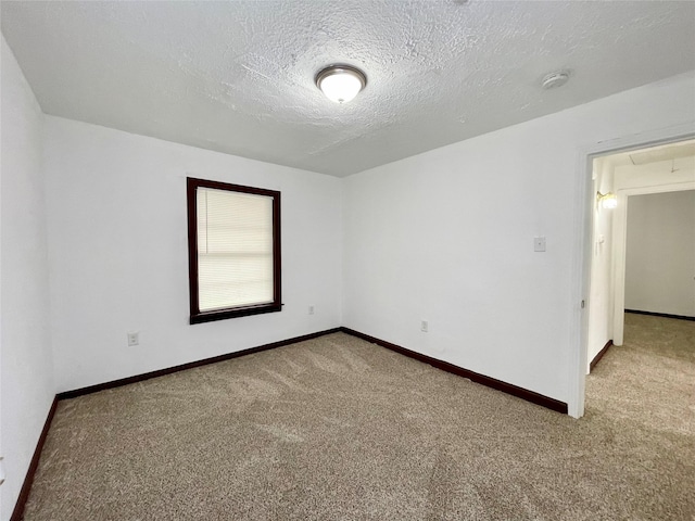 6802 Crestridge St, Houston, TX 77033 - carpeted spare room featuring a smoke detector, baseboards, and a textured ceiling