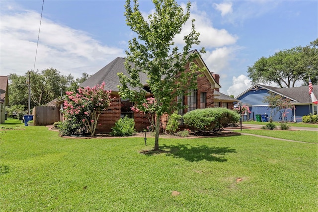 37 N Erik Dr, Angleton, TX 77515 - view of front of house featuring brick siding and a front lawn