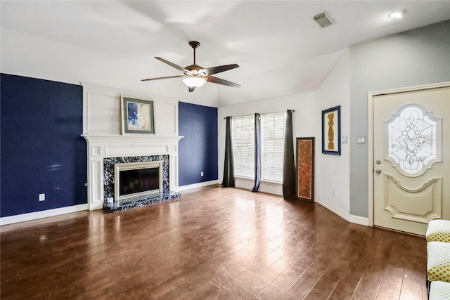 37 N Erik Dr, Angleton, TX 77515 - unfurnished living room with a ceiling fan, wood finished floors, a fireplace, and vaulted ceiling