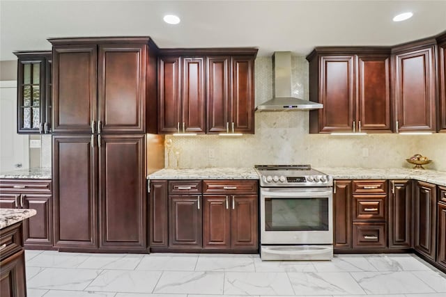 37 N Erik Dr, Angleton, TX 77515 - kitchen featuring stainless steel range with electric cooktop, wall chimney exhaust hood, light marble finish flooring, dark brown cabinets, and recessed lighting
