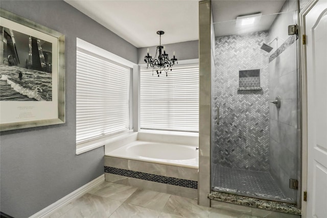 37 N Erik Dr, Angleton, TX 77515 - bathroom with a stall shower, a garden tub, a chandelier, and marble look tiles