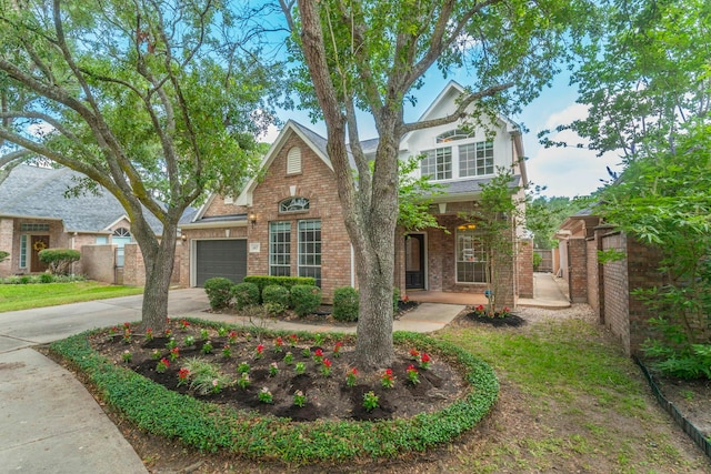 5407 Lake Place Dr, Houston, TX 77041 - traditional-style house with driveway, a garage, brick siding, and covered porch