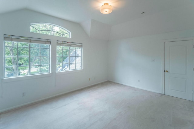 5407 Lake Place Dr, Houston, TX 77041 - unfurnished room featuring light carpet, vaulted ceiling, and baseboards