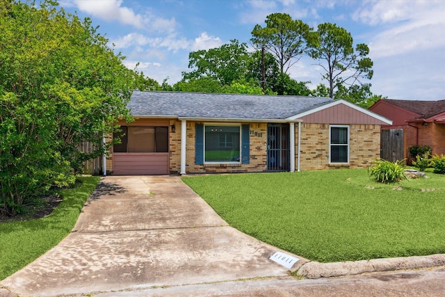 11011 Carlton Dr, Houston, TX 77047 - single story home with brick siding, a front yard, a shingled roof, and driveway