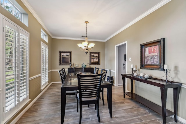 16342 Granite Park Ct, Cypress, TX 77429 - dining area featuring a chandelier, ornamental molding, baseboards, and wood finished floors