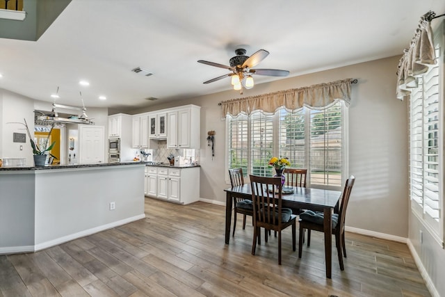 16342 Granite Park Ct, Cypress, TX 77429 - dining space featuring a ceiling fan, recessed lighting, wood finished floors, and baseboards