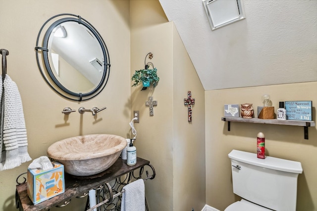 16342 Granite Park Ct, Cypress, TX 77429 - bathroom with toilet, lofted ceiling, and a sink