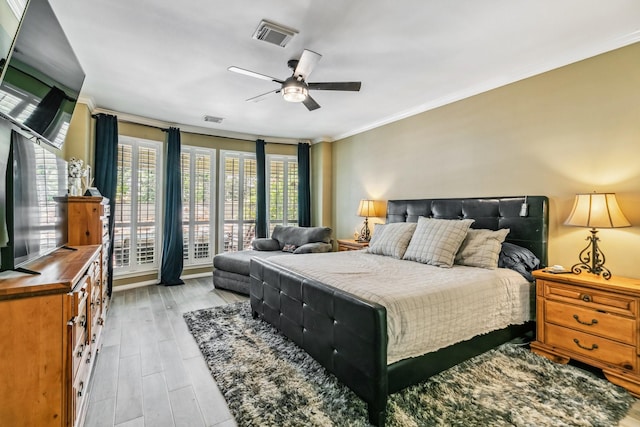 16342 Granite Park Ct, Cypress, TX 77429 - bedroom with crown molding, light wood finished floors, and a ceiling fan