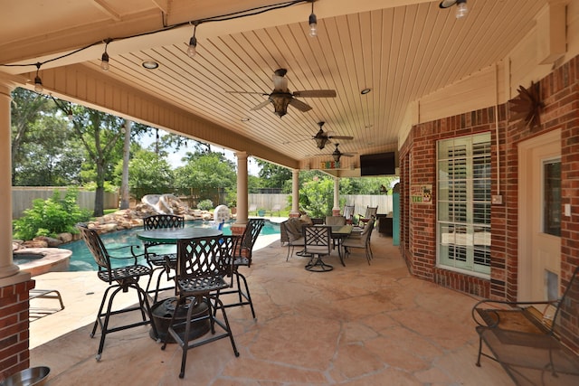16342 Granite Park Ct, Cypress, TX 77429 - fenced backyard with outdoor dining area, a patio, a ceiling fan, and a hot tub