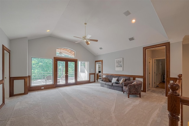 12214 Francel Ln, Cypress, TX 77429 - living room with light colored carpet, a ceiling fan, a wainscoted wall, french doors, and high vaulted ceiling