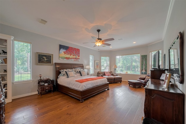 12214 Francel Ln, Cypress, TX 77429 - bedroom with multiple windows, light wood-type flooring, ornamental molding, recessed lighting, and ceiling fan