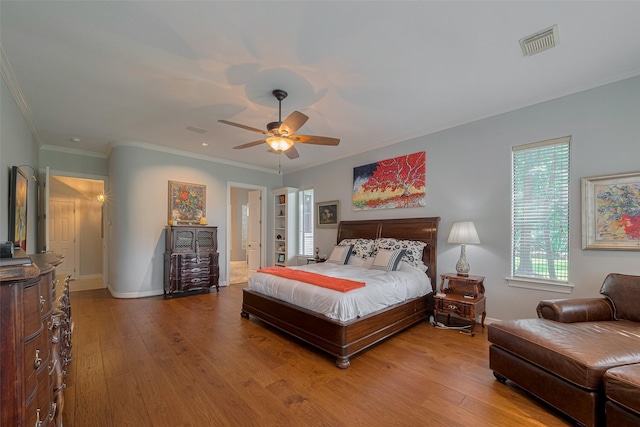 12214 Francel Ln, Cypress, TX 77429 - bedroom with light wood-style flooring, crown molding, ceiling fan, and connected bathroom