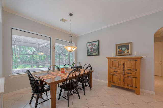 12214 Francel Ln, Cypress, TX 77429 - dining space featuring crown molding, light tile patterned floors, a sunroom, and arched walkways