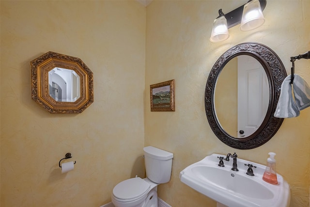12214 Francel Ln, Cypress, TX 77429 - half bathroom with a sink and toilet