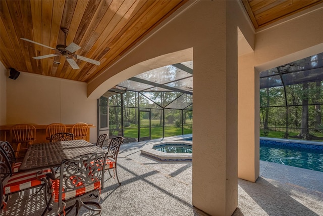 12214 Francel Ln, Cypress, TX 77429 - view of patio / terrace with ceiling fan, outdoor dining space, a lanai, and a pool with connected hot tub
