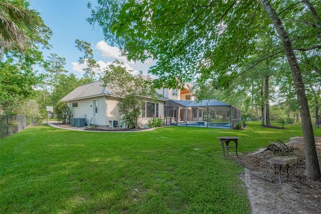 12214 Francel Ln, Cypress, TX 77429 - back of house with a pool, glass enclosure, and a metal roof