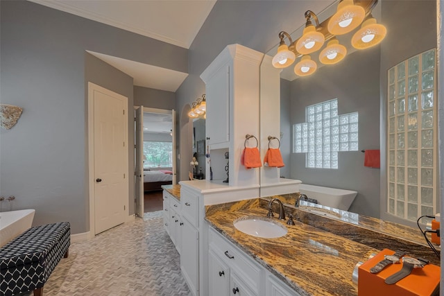 12214 Francel Ln, Cypress, TX 77429 - full bathroom with a soaking tub, ensuite bathroom, vanity, and ornamental molding