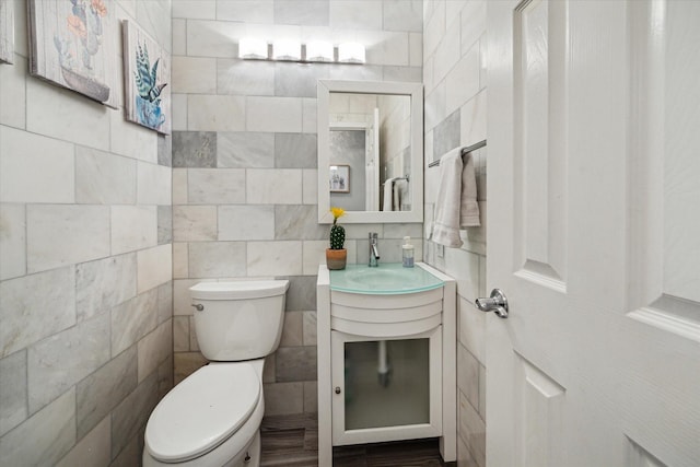 1510 Apple Park Dr, Katy, TX 77450 - half bathroom featuring tile walls, vanity, and toilet