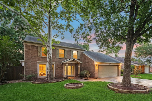 1510 Apple Park Dr, Katy, TX 77450 - colonial home featuring a garage, driveway, brick siding, and a chimney