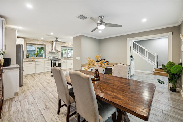 1510 Apple Park Dr, Katy, TX 77450 - dining area featuring ceiling fan, recessed lighting, light wood-type flooring, ornamental molding, and stairway