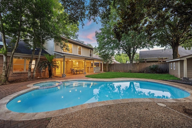 1510 Apple Park Dr, Katy, TX 77450 - pool at dusk with a patio area and a pool with connected hot tub