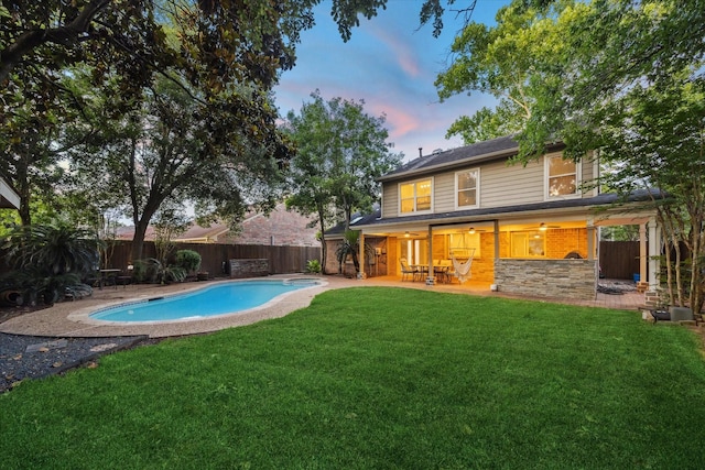 1510 Apple Park Dr, Katy, TX 77450 - back of house at dusk with a patio