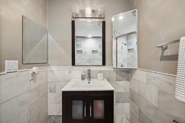 1510 Apple Park Dr, Katy, TX 77450 - bathroom featuring tile walls, tiled shower, and vanity
