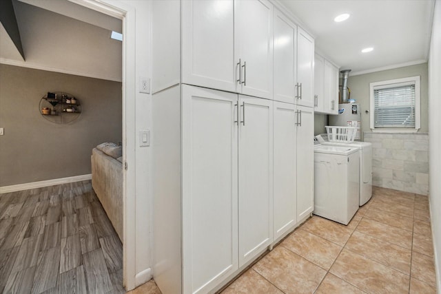 1510 Apple Park Dr, Katy, TX 77450 - washroom with independent washer and dryer, ornamental molding, gas water heater, cabinet space, and recessed lighting