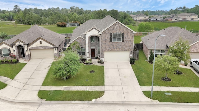 1362 Tee Time Ct, Crosby, TX 77532 - french provincial home with concrete driveway, brick siding, and a front lawn