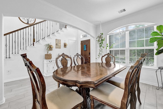1362 Tee Time Ct, Crosby, TX 77532 - dining room with ornamental molding, stairway, arched walkways, and baseboards