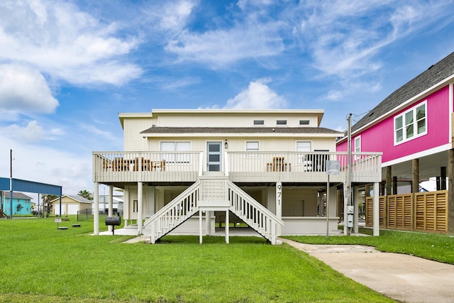 971 Mary Ann, Crystal Beach, TX 77650 - back of property featuring a lawn, a wooden deck, and stairway