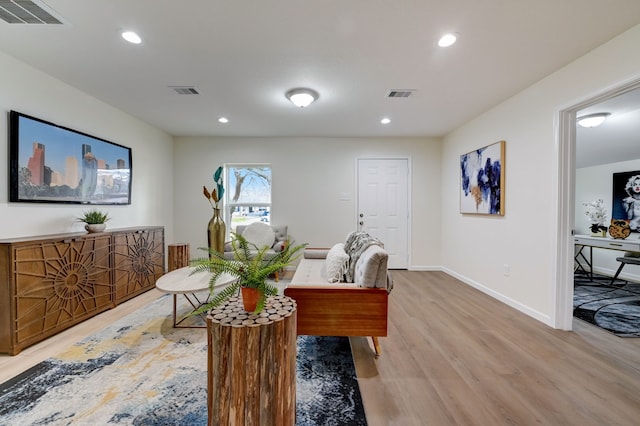 104 18th Ave N, Texas City, TX 77590 - living room featuring light wood-style floors, recessed lighting, and baseboards