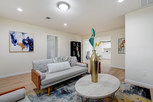 104 18th Ave N, Texas City, TX 77590 - living room with baseboards, light wood-style floors, and recessed lighting