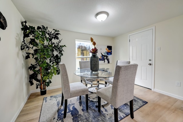 104 18th Ave N, Texas City, TX 77590 - dining area featuring light wood-type flooring and baseboards
