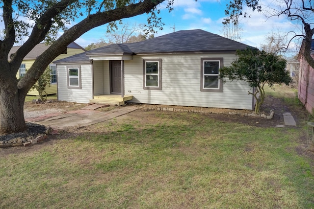 104 18th Ave N, Texas City, TX 77590 - single story home with a front lawn and roof with shingles