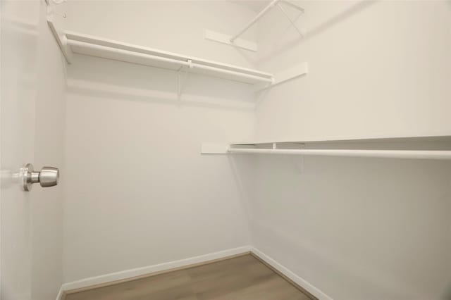 8718 Maplecrest Dr, Houston, TX 77099 - walk in closet featuring light wood-style floors