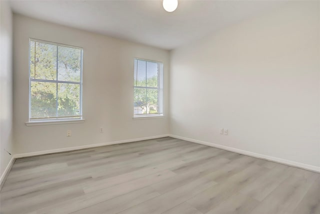 8718 Maplecrest Dr, Houston, TX 77099 - unfurnished room with wood finished floors and baseboards