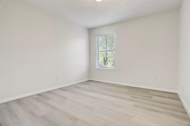 8718 Maplecrest Dr, Houston, TX 77099 - spare room featuring light wood-style floors and baseboards
