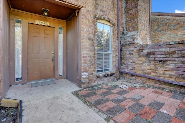 8718 Maplecrest Dr, Houston, TX 77099 - doorway to property with brick siding